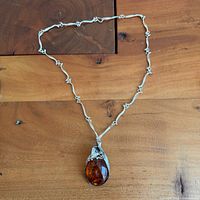 Full view of necklace showing pendant and entire chain