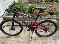 Left side view showing full bike, frame, wheels, rear suspension and mudguard