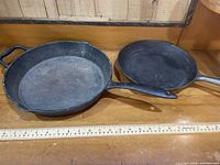 Top view of both Lagostina skillets side-by-side with ruler for scale