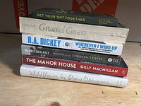 Stack of six books front view showing titles