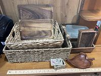 Overall lot showing baskets, wooden tray, leaf bowl, stone box with ruler for scale