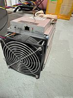 Front view showing fan, RJ45 port, status LEDs and overall unit