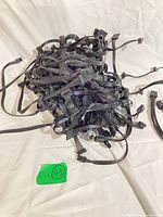 Pile of black flat ribbon modular power supply cables