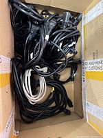 Box of coiled IEC power cords