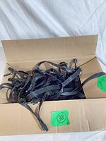 Box containing multiple black flat ribbon PCIe cables