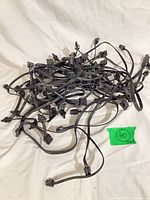 Pile of 17 black flat ribbon 4-pin splitter cables