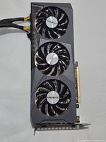 Full view of GPU showing three fans and PCIe connector