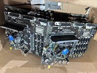 Stack of ASUS B250 Mining Expert motherboards with attached Intel coolers