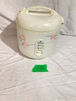 Full view of National SR-SH10N rice cooker showing exterior and floral design