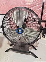 Full view of Power Fist 20" metal floor fan on stand