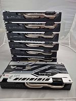 Stack of six GPUs showing backplates and heat pipes