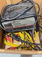 Charger with bundled leads in box