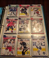 page of nine O-Pee-Chee 2009-10 cards in binder
