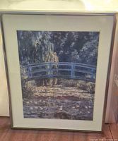 Front view of framed Monet print with mat and metal frame