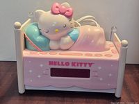 Front view showing LED display, Hello Kitty figure, bed design