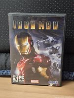 Front of plastic game case showing Iron Man artwork, ESRB Teen, PC DVD-ROM logos
