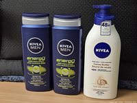 Front view showing three Nivea Men Energy shower gels and one Nivea Cocoa Butter lotion