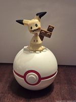 Front view of assembled Mimikyu on Poké Ball