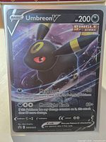 Front of Umbreon V Black Star Promo card in toploader