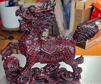 Left side view showing entire sculpture, scales, saddle, tail