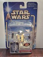 Front view of sealed R2-D2 action figure in blister package