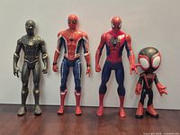 Group shot of all four Spider-Man figures standing upright