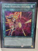 Front of Dark Burning Attack card inside protective sleeve