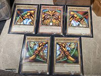 Group shot of all five Exodia cards in sleeves