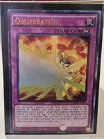 Front view of Obliterate!!! card showing artwork, title and card text