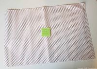 Full view of stacked tissue sheets showing size and heart pattern