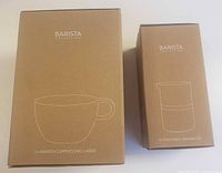 Factory-sealed box containing 2 large Barista cappuccino mugs and sealed box containing stackable serving set