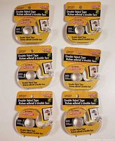 Six identical retail-carded rolls of double-sided tape
