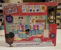 Front of unopened box showing product name, figure window, contents overview