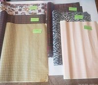 All five bundles of tissue paper laid out showing patterns and sticky note counts