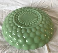 Exterior base showing raised bubble pattern and sunburst foot