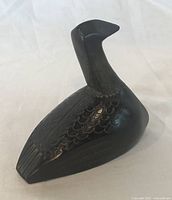Front left view of bird figurine