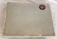 Front cover showing grey cloth boards and Group of 7 logo