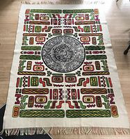 Full view Aztec calendar side with colourful abstract motifs
