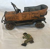 Side view of tin taxi and driver figure