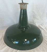 Full view of green enamel industrial lamp shade