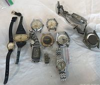 Group shot of all watches laid out on cloth