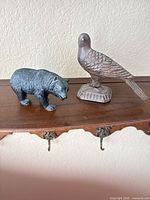 Bear and bird figurines on shelf