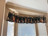 Three floral valances installed on windows