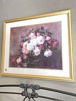 Full view of framed floral print on wall