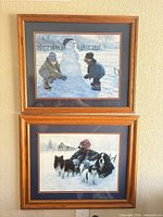 Both framed prints hung vertically