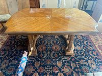 Tabletop showing starburst veneer pattern and seam for leaf