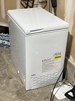 Right side view showing entire freezer, R600a refrigerant label