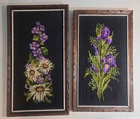 Both framed needlepoint pictures side by side