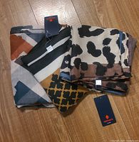 All three Asmara scarves with tags visible