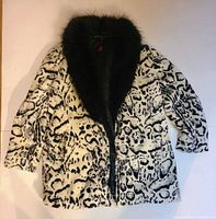 Front view of faux fur animal-print jacket with black collar